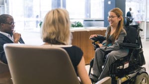 woman in wheelchair being interviewed for a job