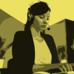 Blurred image of woman typing wearing headphones and microphone