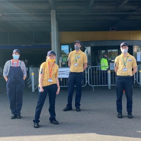 4 people standing in front of IKEA Exeter's store entrance