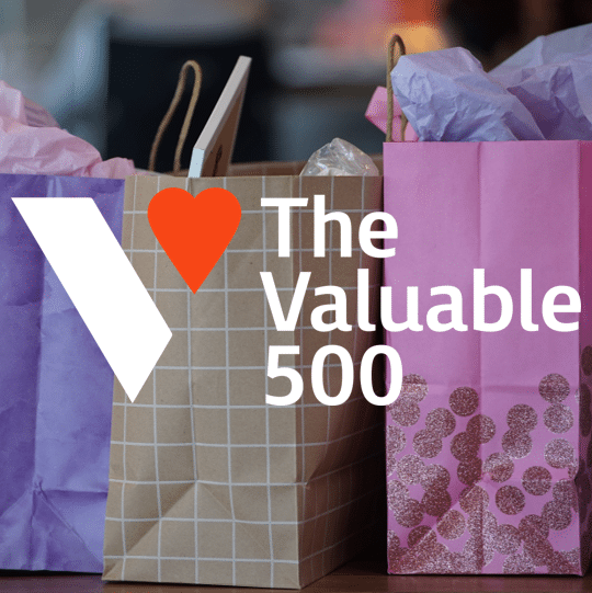 Valuable 500 logo overlaying shopping bags